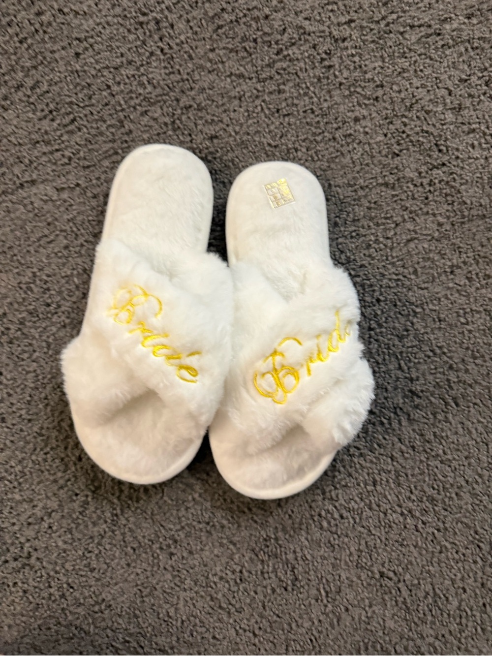 Faux-Fur White Cross-Band Slippers with Gold Script Bride.